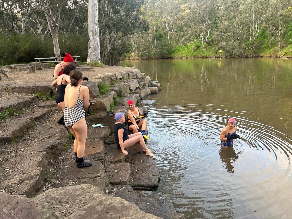 Gently and slowly, the group gets in the river.
